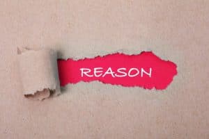 REASONと書かれたピンクの紙