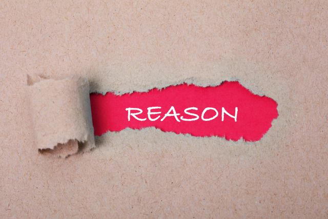 REASONと書かれたピンクの紙